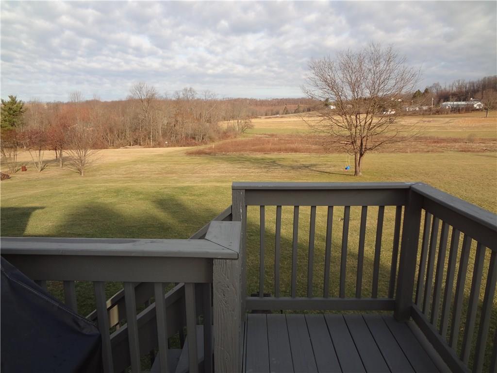 167 Town Country Road Vanderbilt, PA 15486 - Photo 24 of 25 The Deck has steps that lead to the backyard. Perhaps a pool, swings or trampoline would make a nice addition?