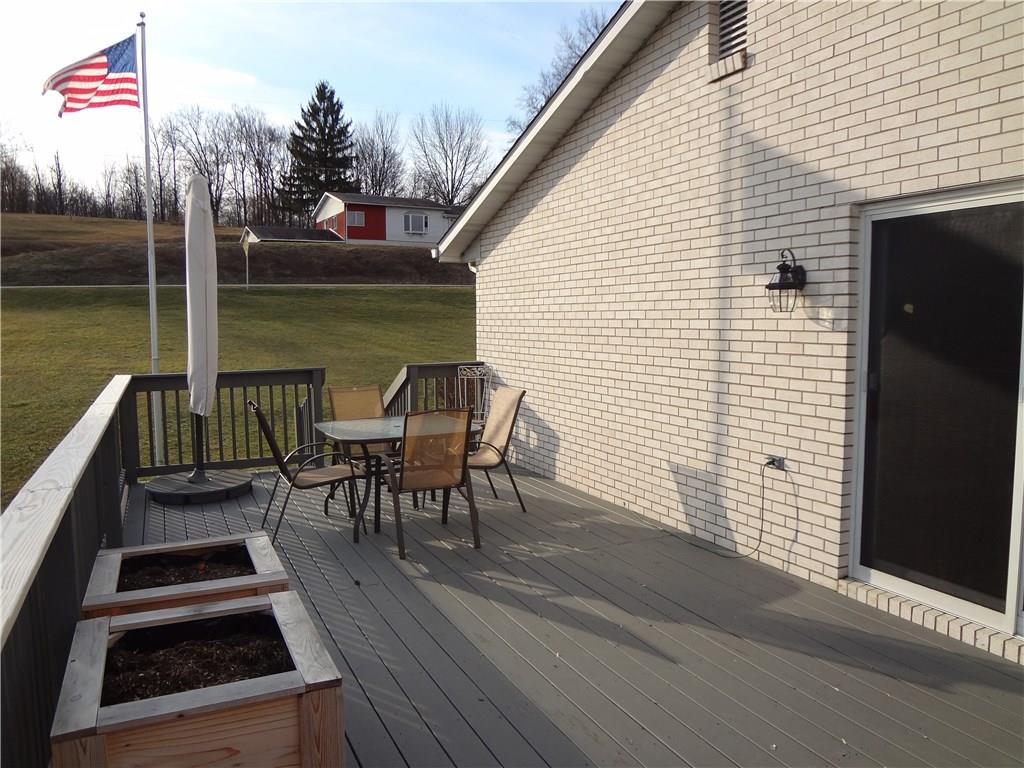 167 Town Country Road Vanderbilt, PA 15486 - Photo 10 of 25 Deck has room for table and chairs and a place to plant flowers for the summer.