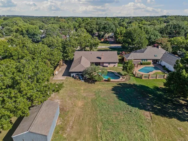 an aerial view of residential house with outdoor space