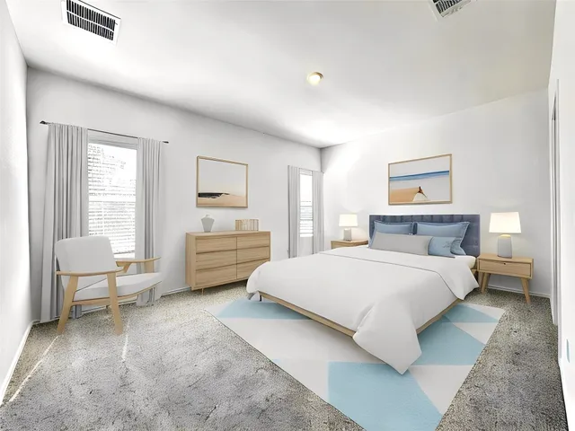 a bedroom with a bed and furniture