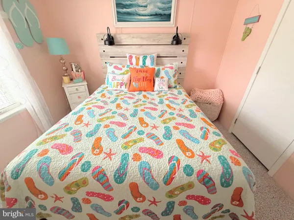 a bedroom with a bed and dresser