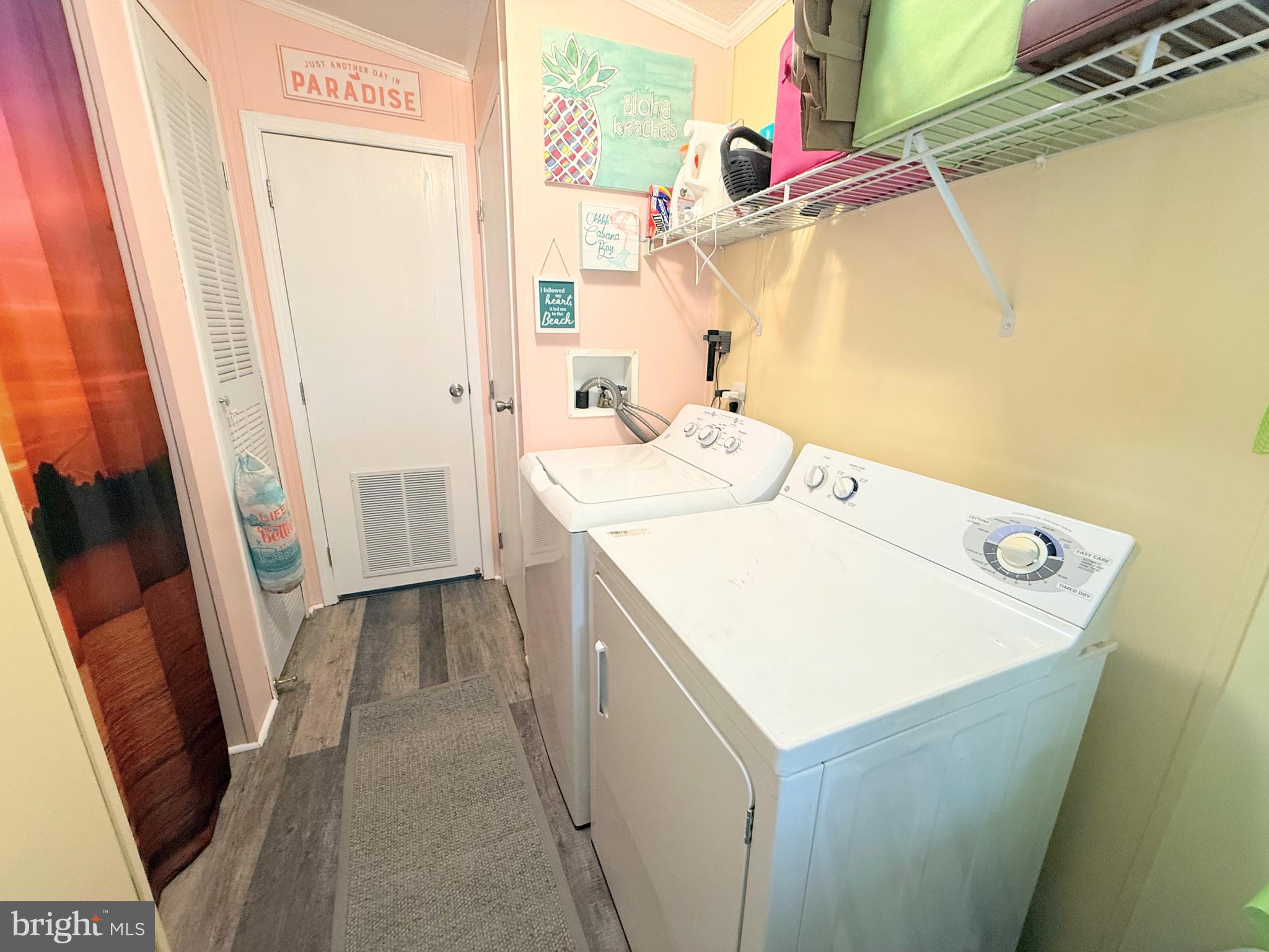 34488 Easy Street, Unit E810 Long Neck, DE 19966 - Photo 36 of 55 a utility room with a sink a washer and dryer