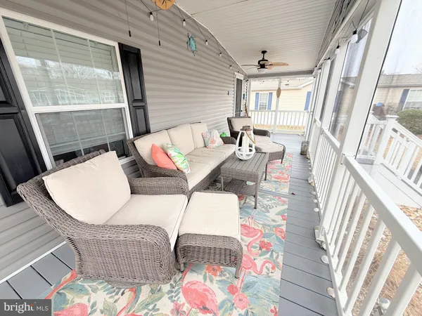 a balcony with table and chairs