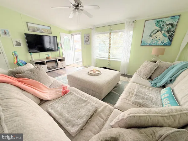 a bedroom with a bed and flat screen tv