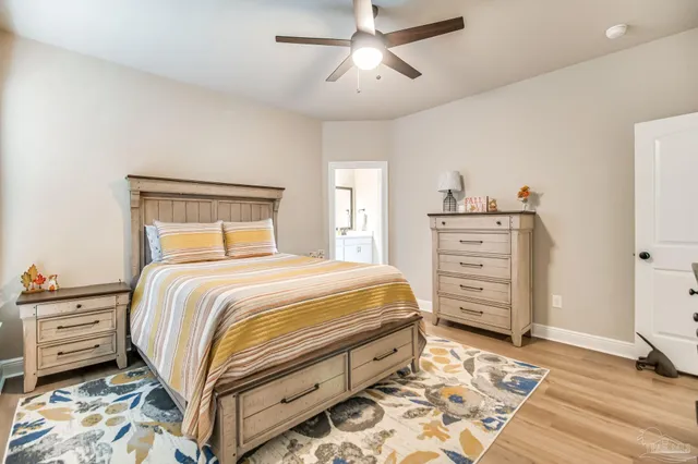 a bedroom with a bed and a dresser