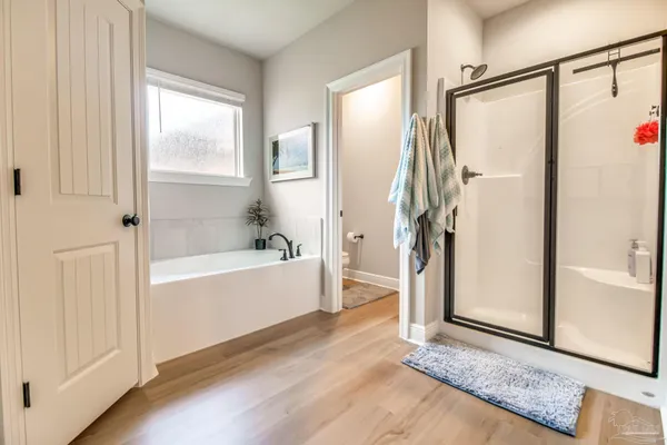 a view of a hallway with closet and a livingroom view