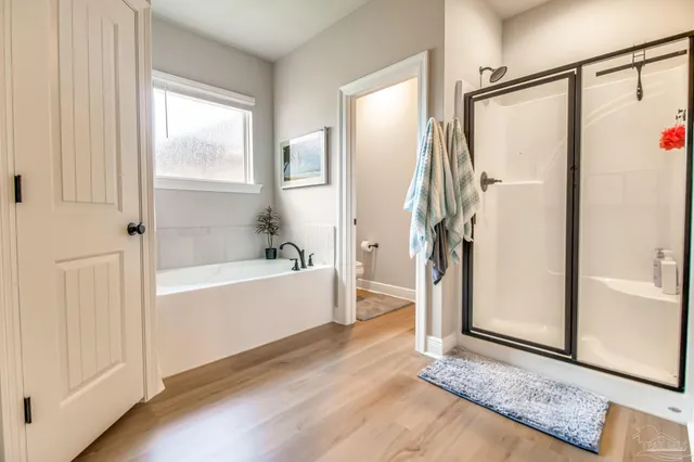 a bathroom with a bathtub and a shower