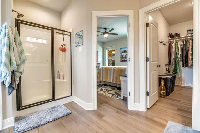 a view of a hallway with closet and a livingroom view