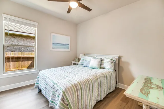 a bedroom with a bed and window