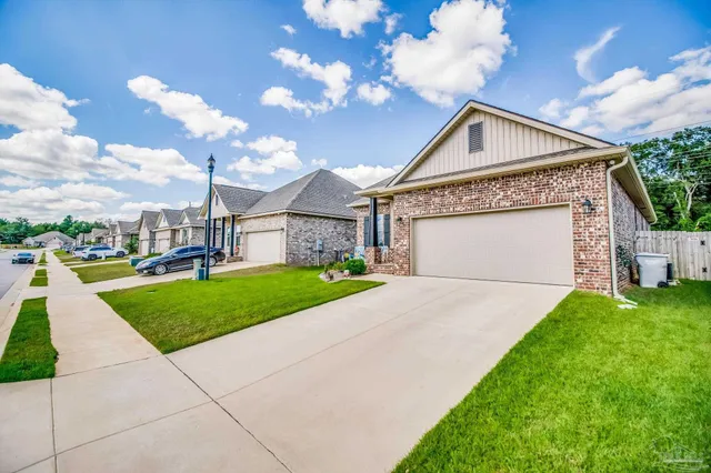 a view of a garden with lawn chairs