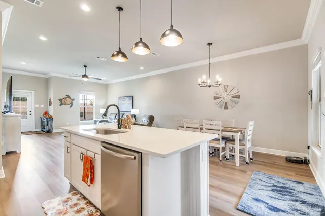 a very nice looking dining room with a table and chairs