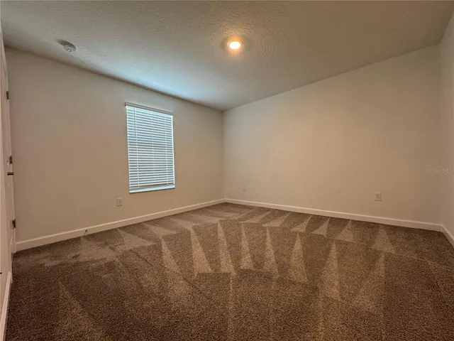 en empty room with windows