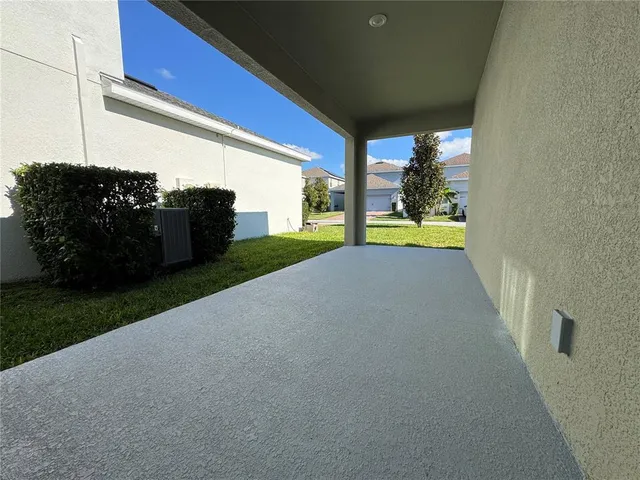 a view of swimming pool with an outdoor seating and a yard