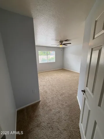 a view of a room with a fireplace