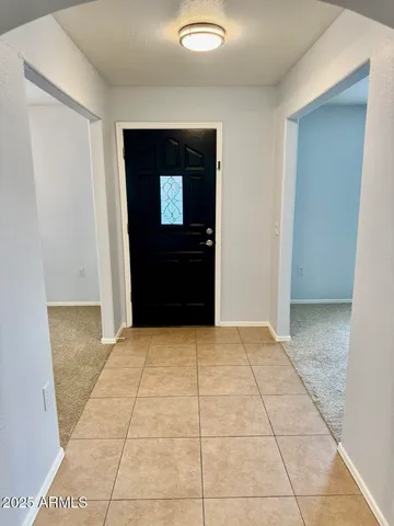 a view of hallway with a front door