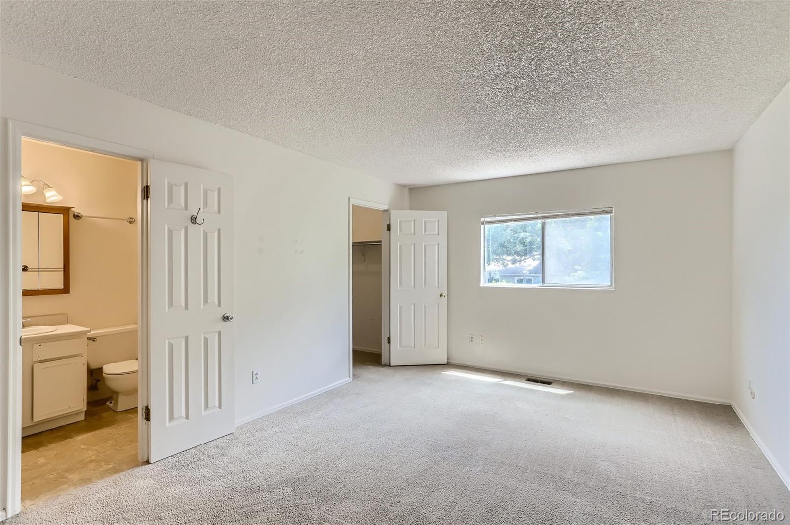 216 Summit Circle Lafayette, CO 80026 - Photo 11 of 31 an empty room with a bathroom and a bathroom