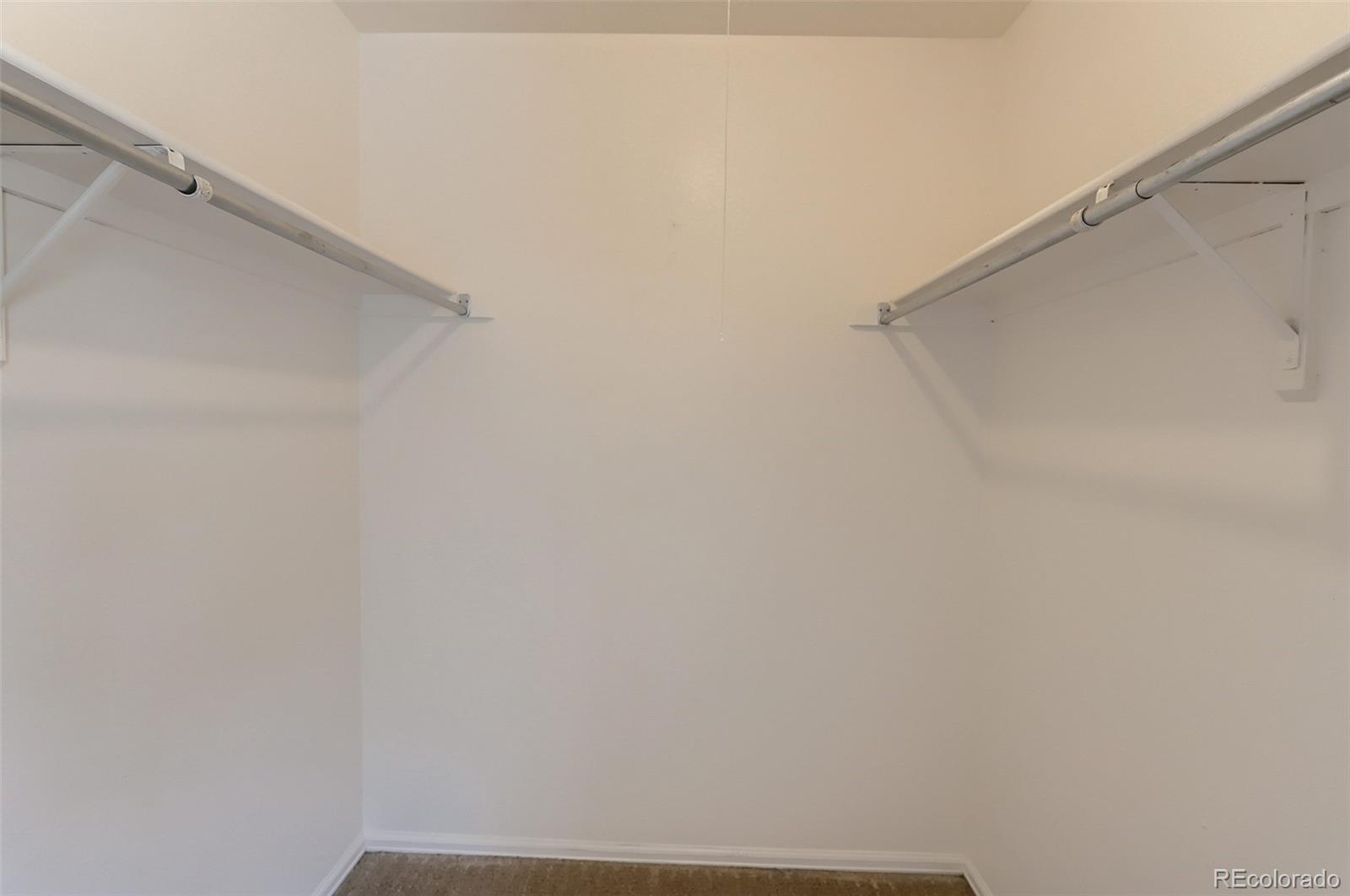 216 Summit Circle Lafayette, CO 80026 - Photo 13 of 31 a view of small space with racks on the wall