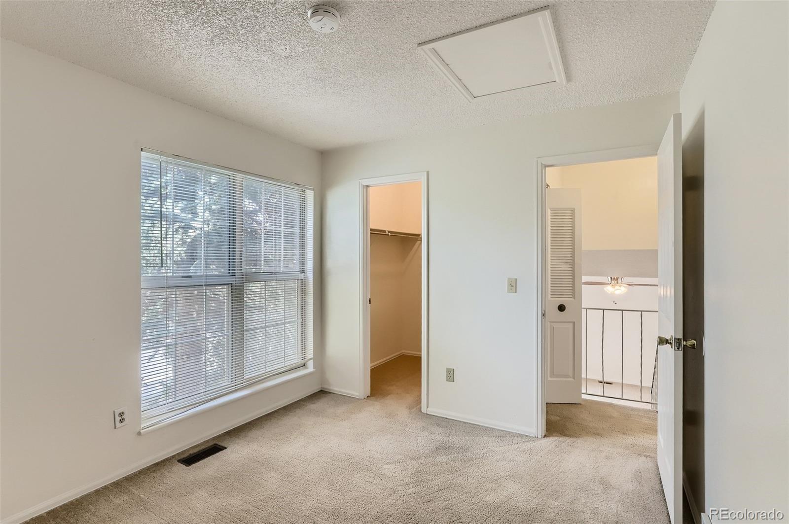 216 Summit Circle Lafayette, CO 80026 - Photo 14 of 31 an empty room with windows