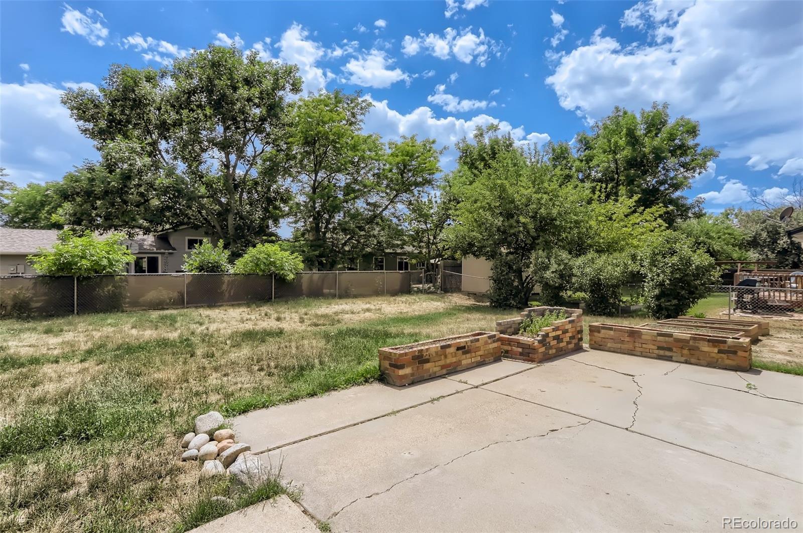 216 Summit Circle Lafayette, CO 80026 - Photo 23 of 31 a view of a road with a yard