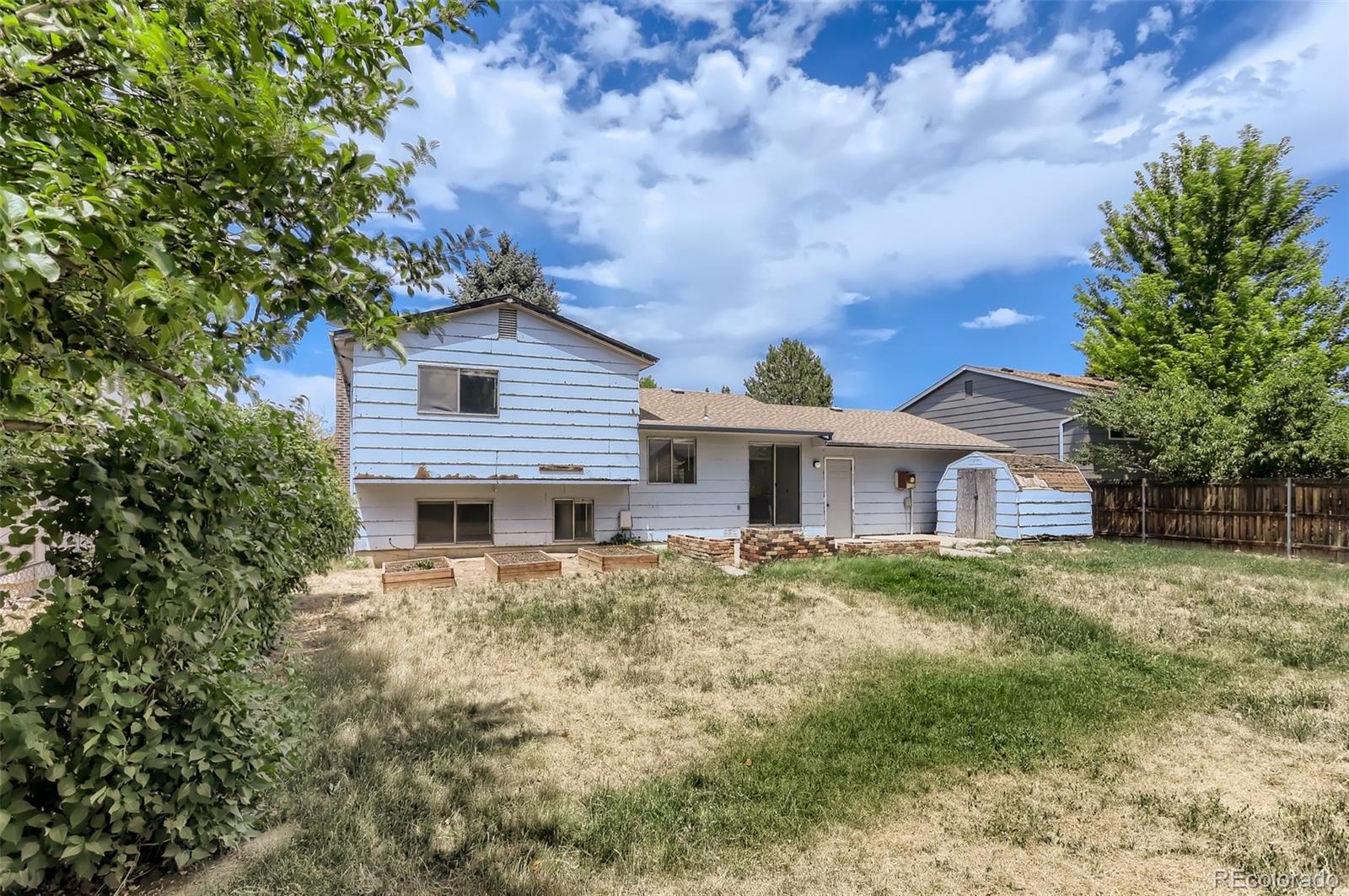 216 Summit Circle Lafayette, CO 80026 - Photo 25 of 31 a house with trees in the background