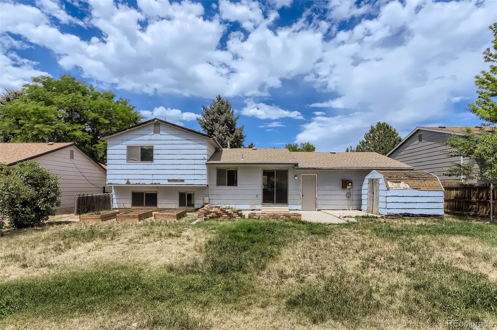 216 Summit Circle Lafayette, CO 80026 - Photo 26 of 31 a house view with a garden space