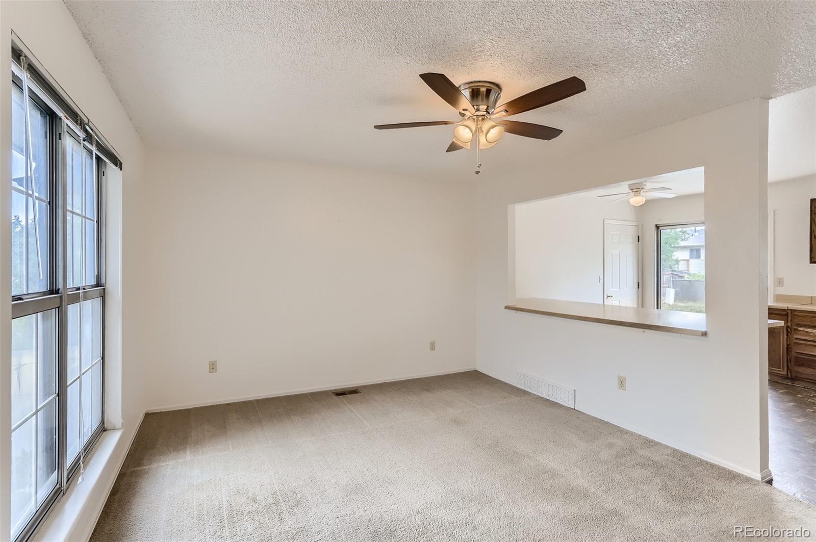 216 Summit Circle Lafayette, CO 80026 - Photo 5 of 31 a view of an empty room with a window
