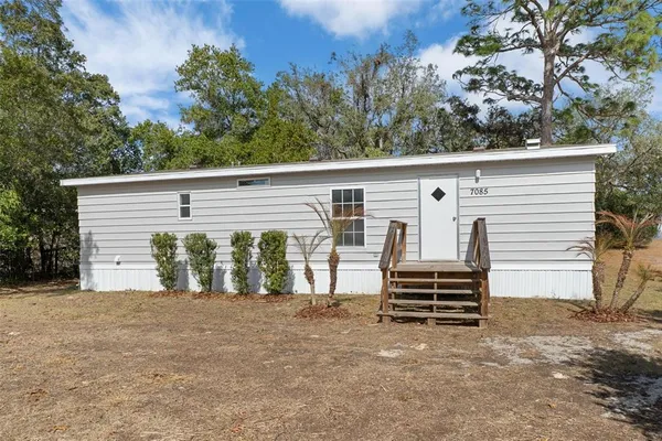 a view of a house with a garage