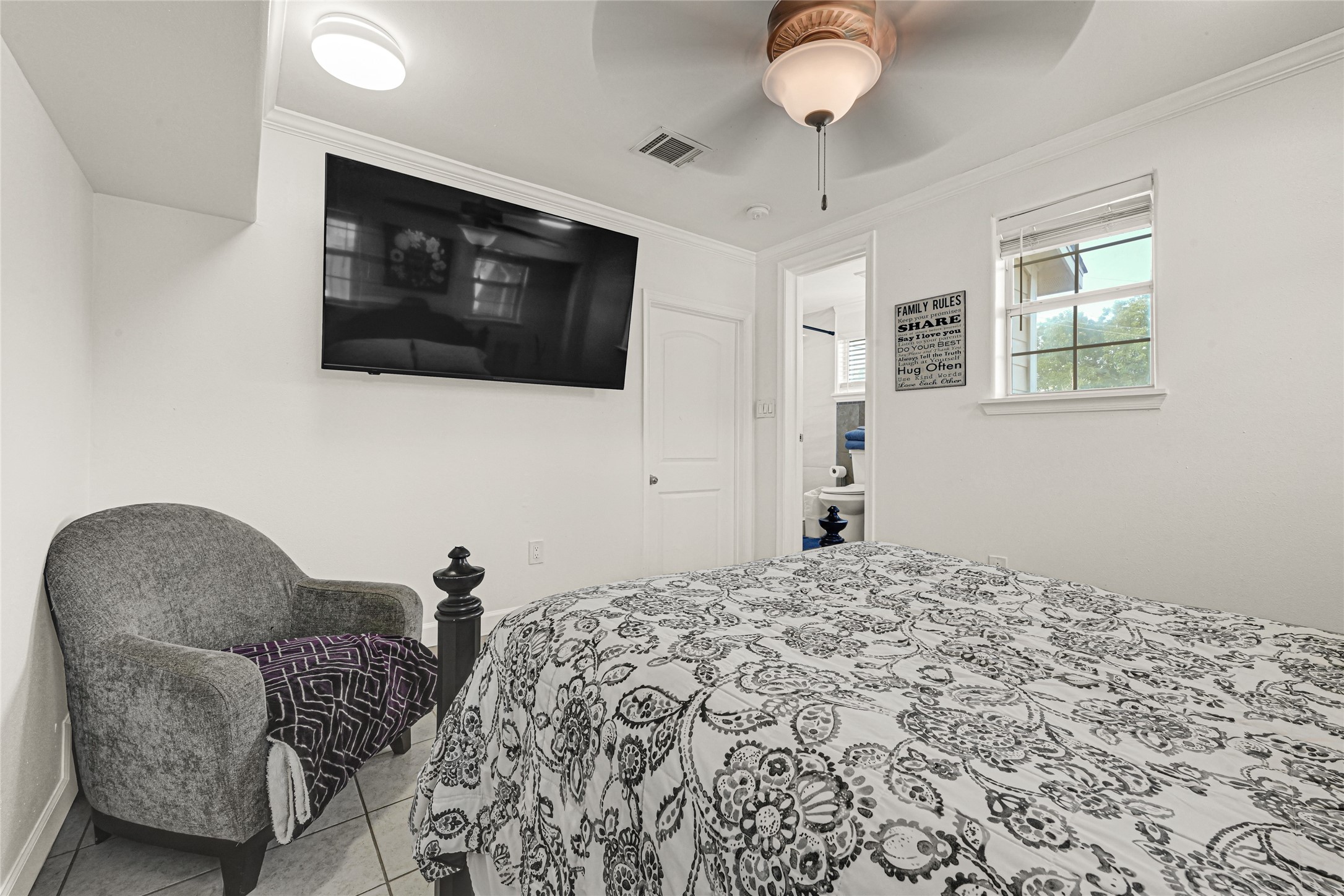 2809 Tooke Street Houston, TX 77023 - Photo 39 of 50 a bedroom with furniture and a flat screen tv