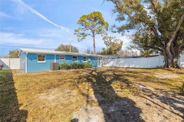 a view of pool of the house with a yard