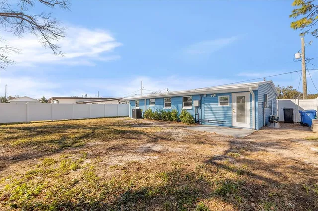 a view of a house with a floor and a big yard