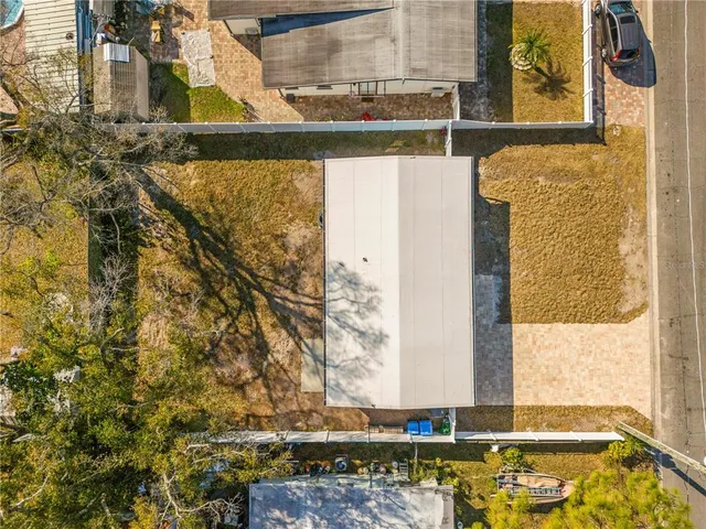 an aerial view of residential building with green space