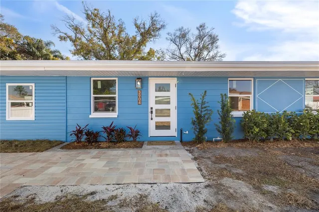 front view of a house with a yard