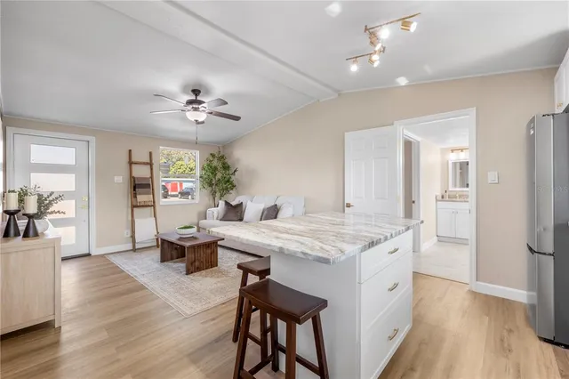 a view of kitchen with cabinets and wooden floor
