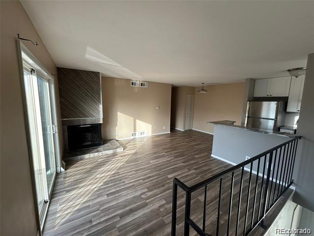 1225 South Oneida Street, Unit 252 Denver, CO 80224 - Photo 1 of 20 a view of a livingroom with furniture and staircase
