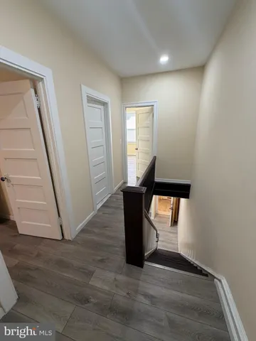 a view of room with window and wooden floor