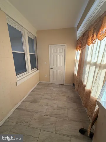 a view of wooden floor in an empty room