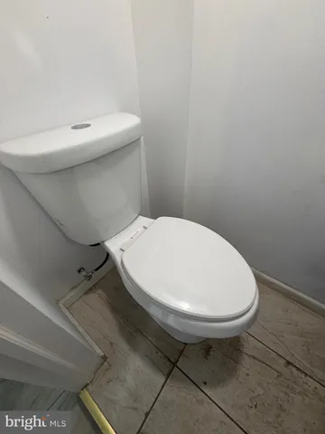 a bathroom with a sink toilet and mirror