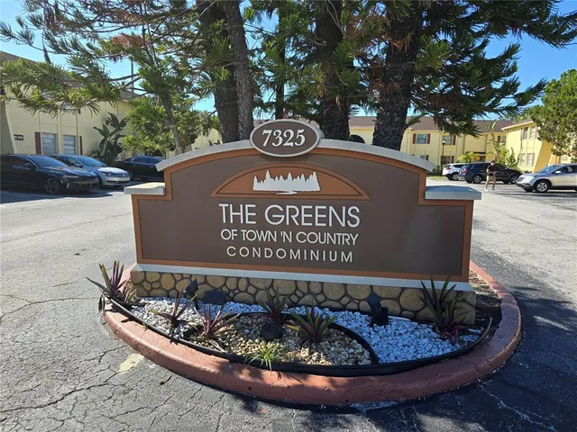 a view of a livingroom with furniture and a mirror