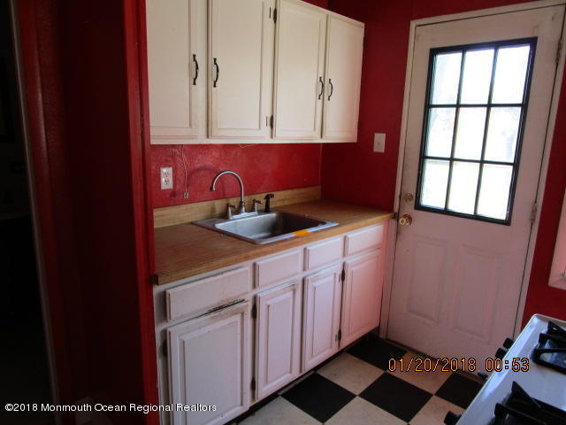 24 Sunset Road Brick, NJ 08723 - Photo 11 of 15 a kitchen with a sink and cabinets