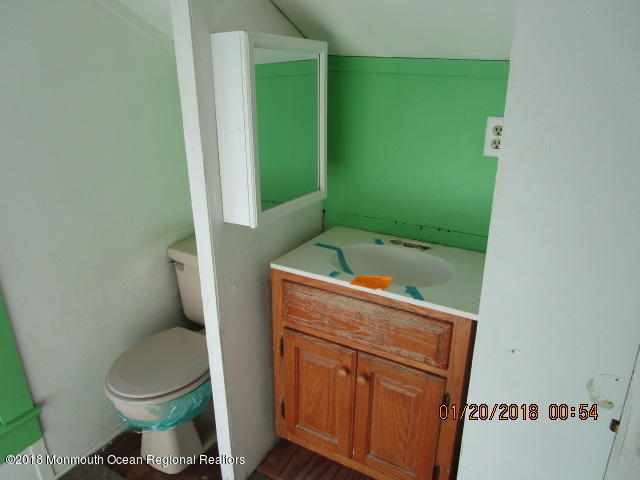 24 Sunset Road Brick, NJ 08723 - Photo 14 of 15 a bathroom with a toilet and a sink