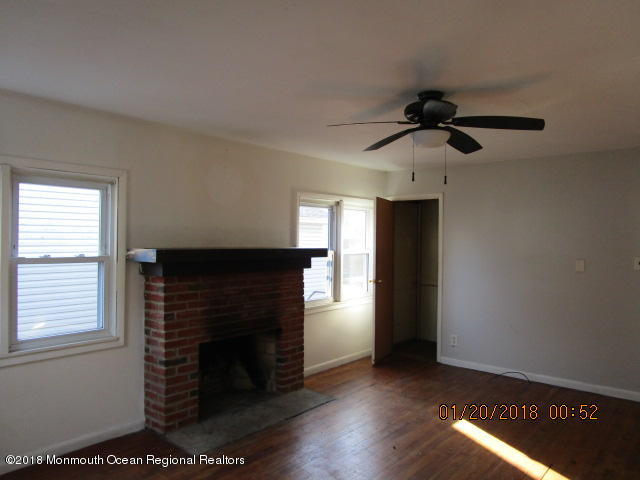 24 Sunset Road Brick, NJ 08723 - Photo 6 of 15 a view of an empty room with wooden floor and a window