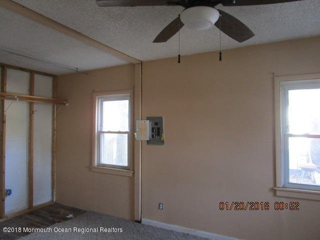 24 Sunset Road Brick, NJ 08723 - Photo 10 of 15 a view of an empty room with a window