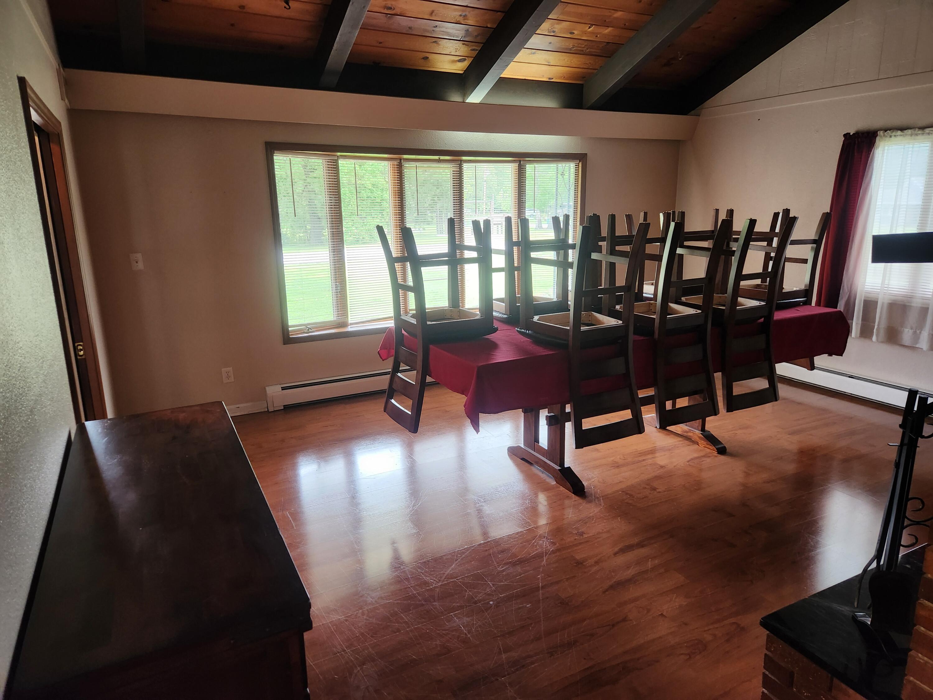 4726 Locksley Drive East Rensselaer, IN 47978 - Photo 12 of 33 a view of a dining room with furniture window and wooden floor