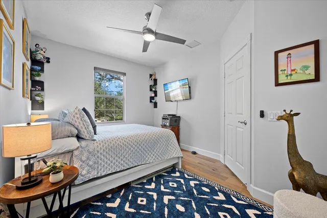 an aerial view of residential houses with outdoor space and swimming pool