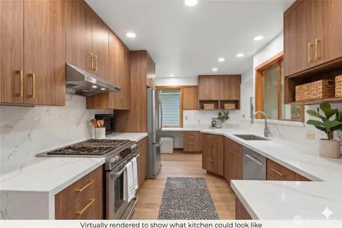 a kitchen with stainless steel appliances granite countertop a sink stove and cabinets