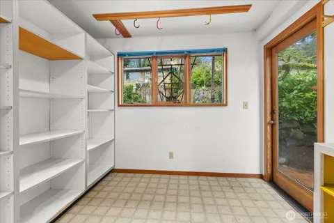 a bedroom with a large bed and a large window