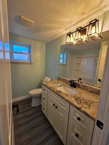 a view of cabinets with wooden floor