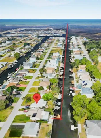 a kitchen with granite countertop a sink cabinets and stainless steel appliances
