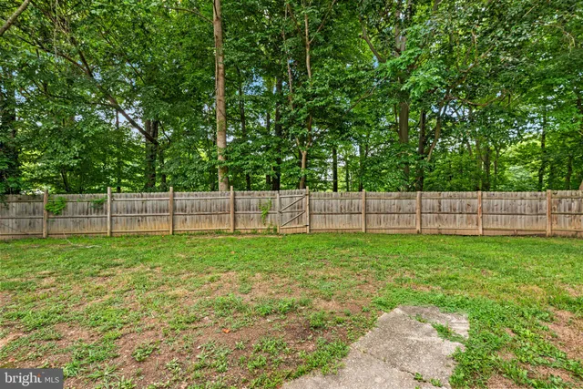 a view of a yard with a fence