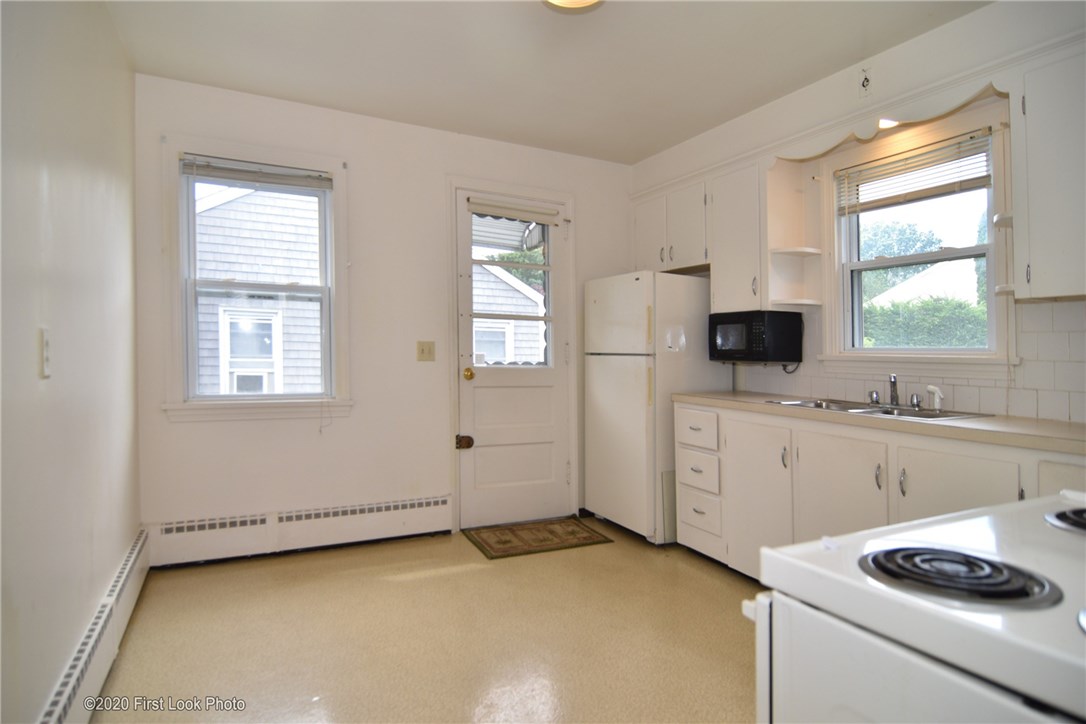 89 Bliss Mine Road Newport, RI 02840 - Photo 11 of 34 Kitchen with view of side door and space for table & chairs